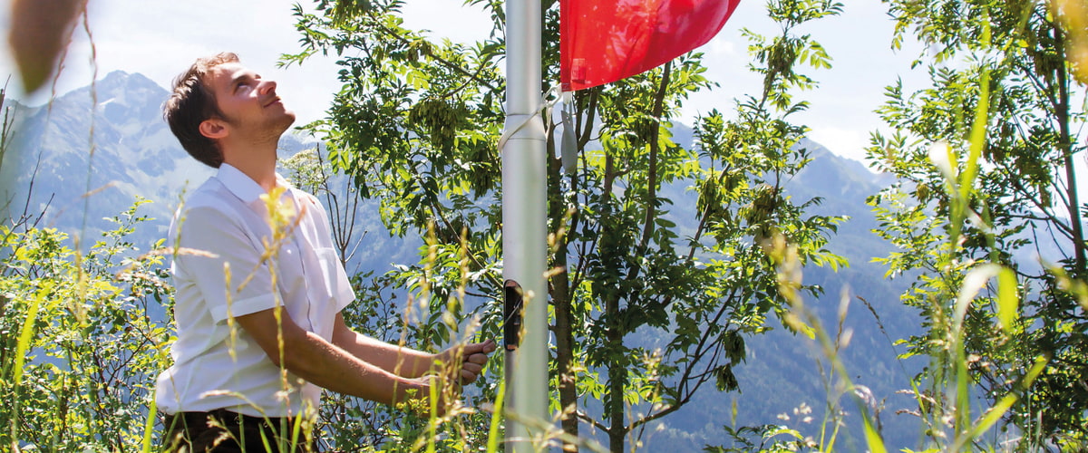 Hoisting a flag on the flagpole Hoisting a flag on the flagpole